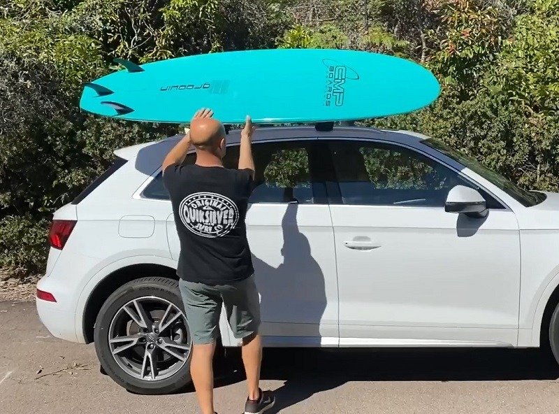 Step Two Lift the Surfboard Onto the Car Roof